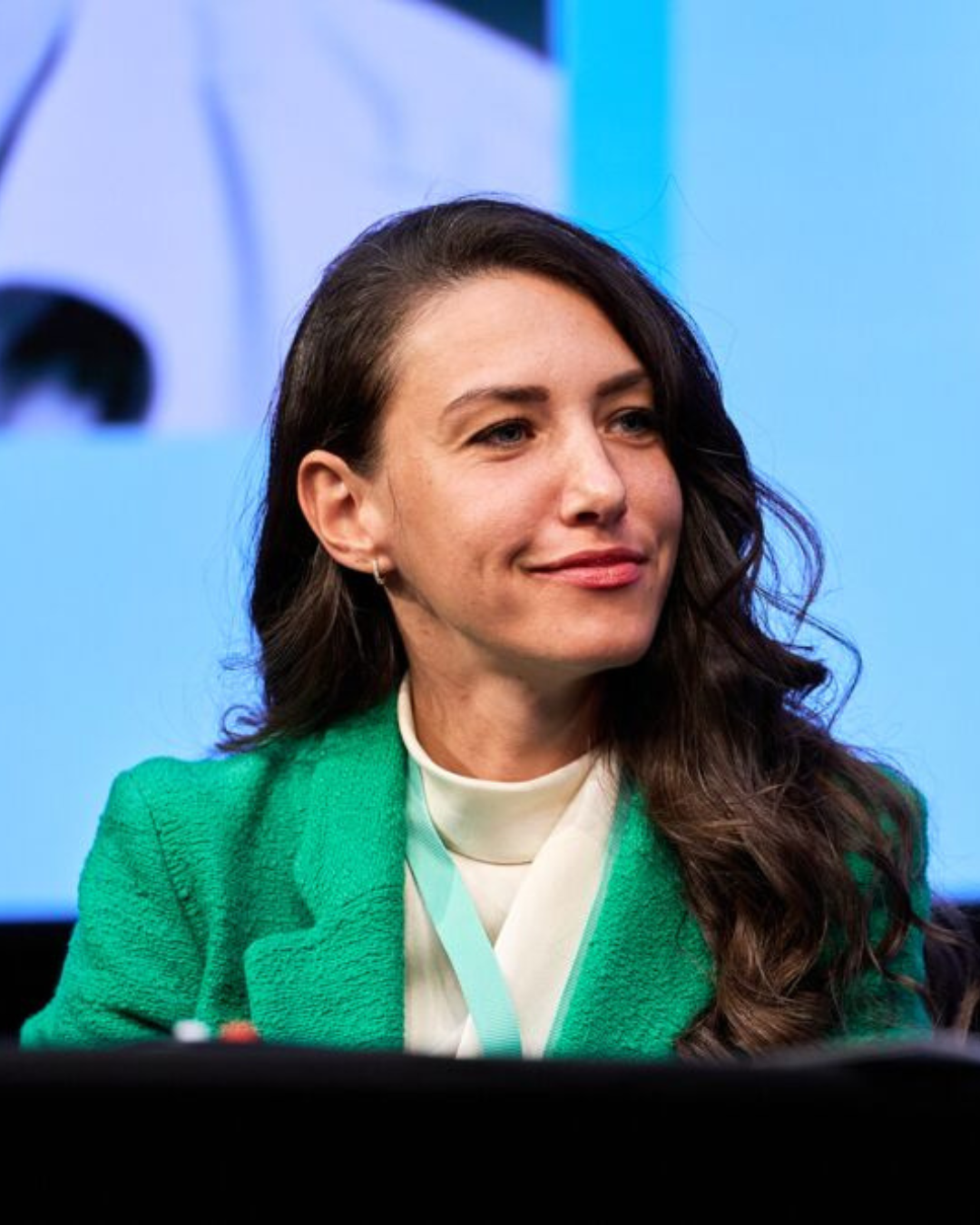 MILE29 speaker on a TEDx-style stage